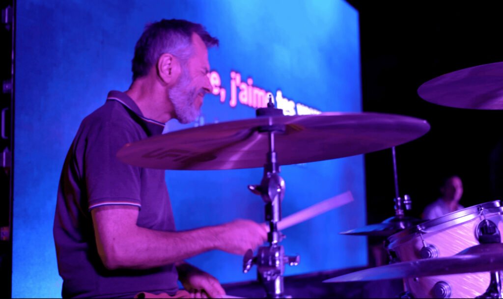 The band's drummer during a song