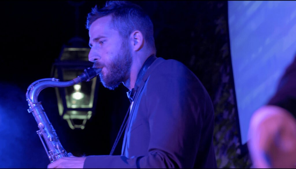 Close-up of the band's saxophonist during a solo